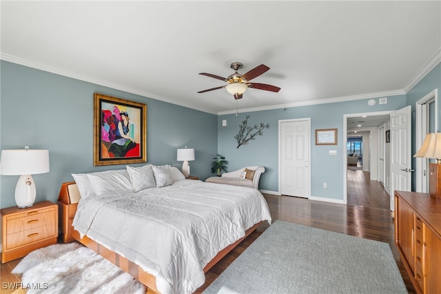 bedroom with ornamental molding, dark wood-type flooring, ceiling fan, and a closet