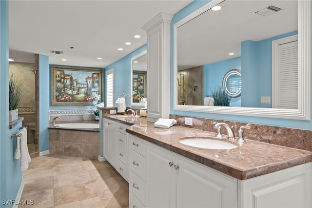 bathroom featuring separate shower and tub and vanity