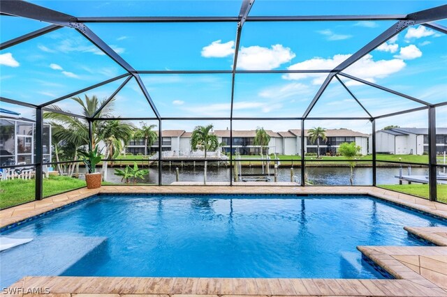 view of pool with glass enclosure