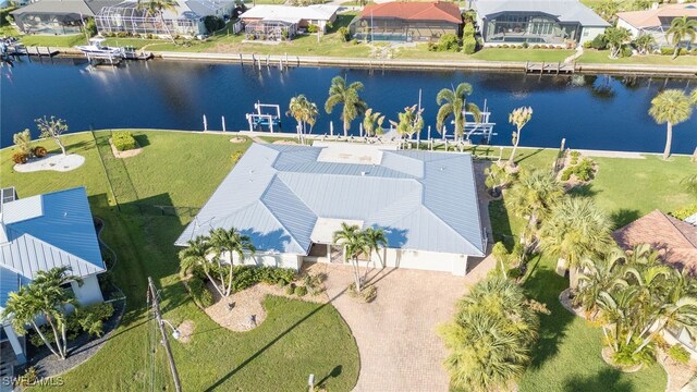 birds eye view of property with a water view