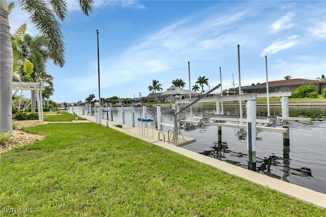 dock area featuring a water view and a yard