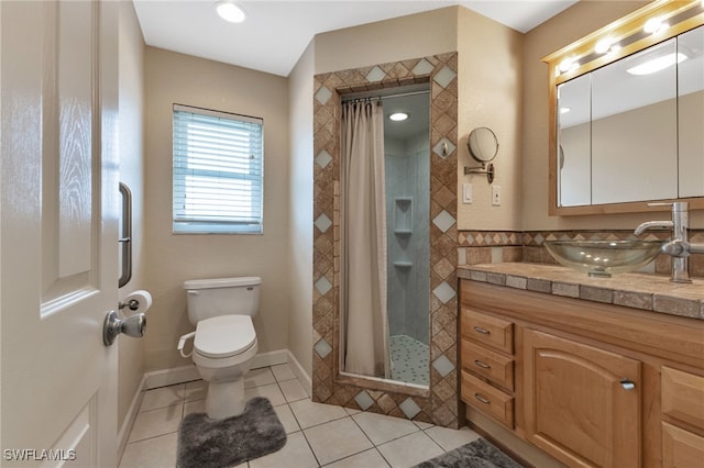 bathroom with walk in shower, tile patterned floors, vanity, and toilet