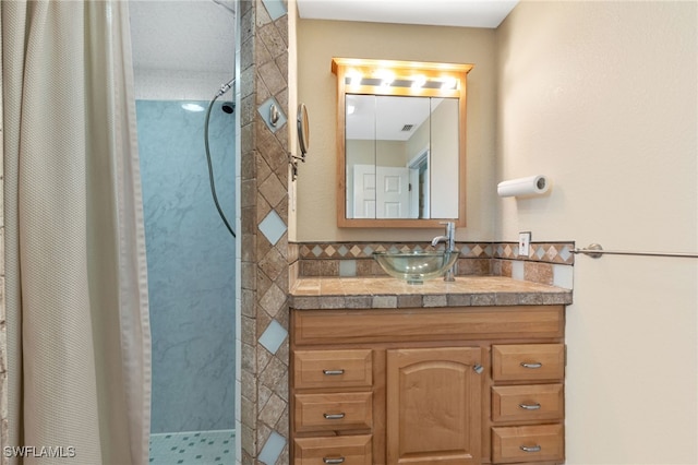 bathroom featuring vanity and a shower with shower curtain