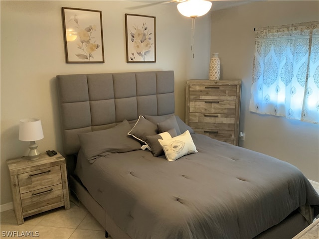 bedroom featuring ceiling fan and light tile patterned floors