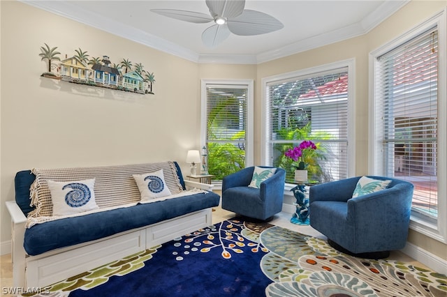 living area with ornamental molding and ceiling fan