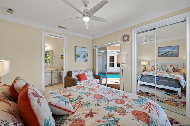 bedroom with multiple closets, ceiling fan, ensuite bathroom, and crown molding