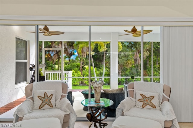 sunroom / solarium with ceiling fan