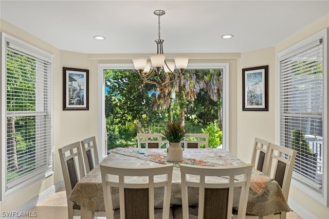 dining area with an inviting chandelier