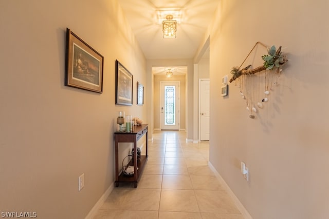 corridor featuring light tile patterned floors