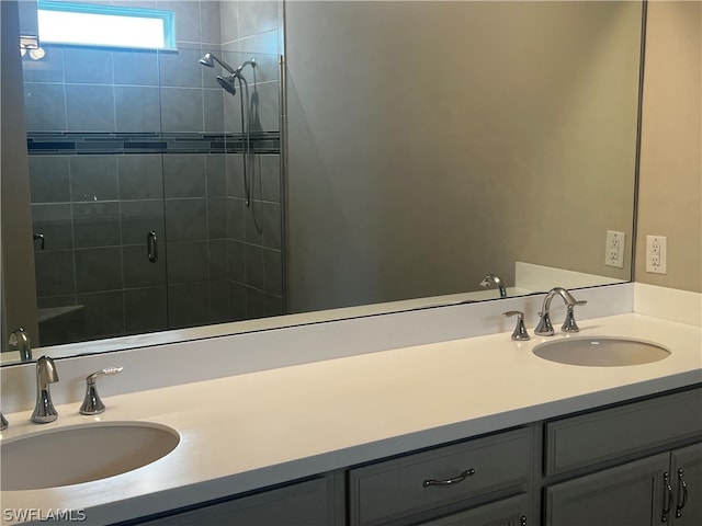 bathroom with vanity and a shower with shower door