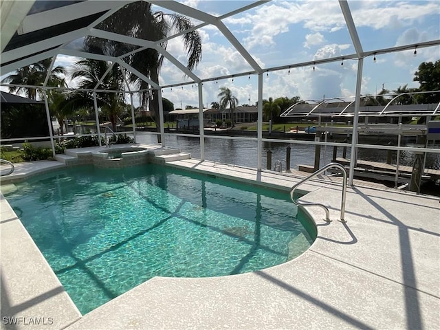 view of pool featuring a water view, glass enclosure, an in ground hot tub, and a patio area