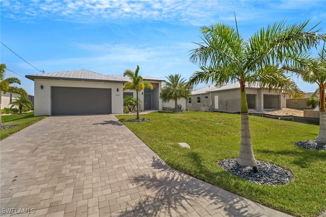 single story home with a garage and a front yard