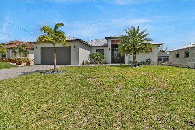 view of front facade with a garage and a front yard