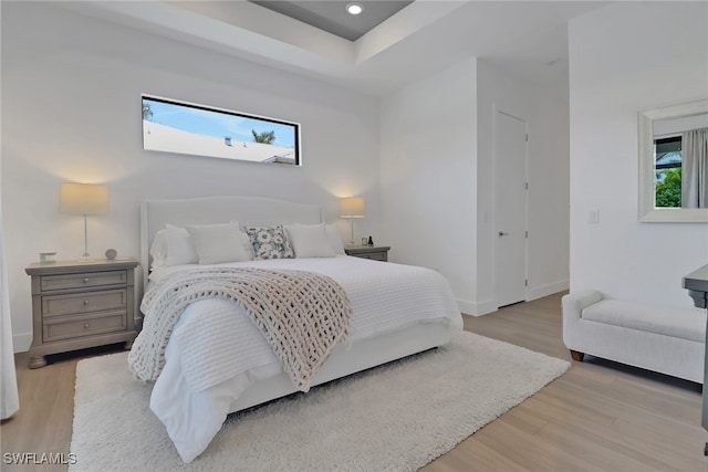 bedroom with light hardwood / wood-style flooring