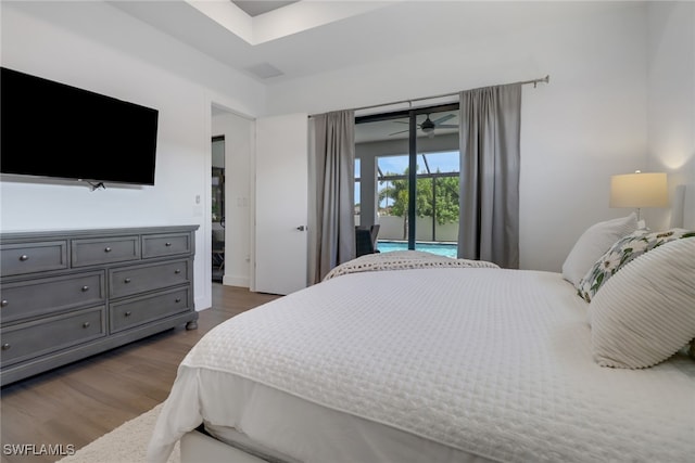 bedroom featuring dark hardwood / wood-style floors and access to exterior