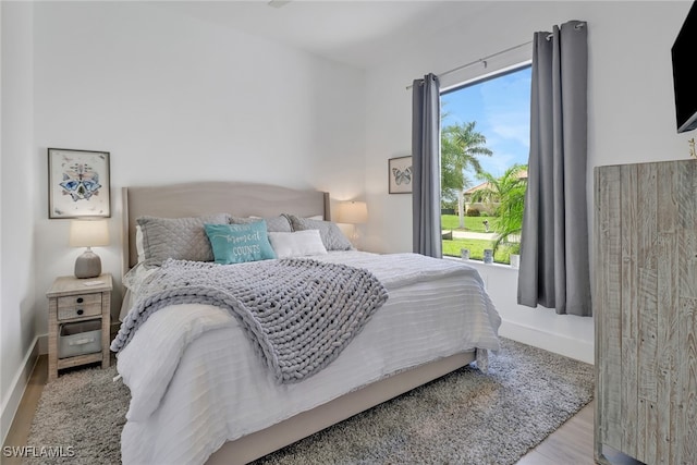 bedroom with light hardwood / wood-style flooring