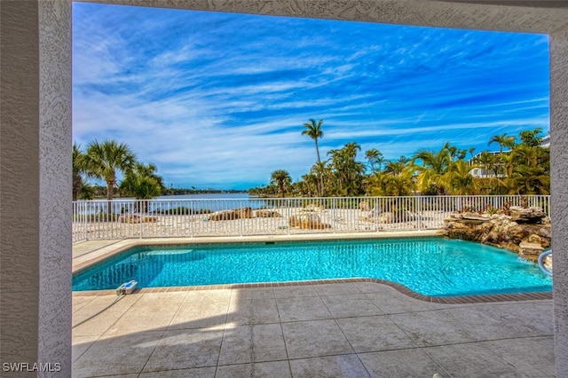 view of swimming pool with a patio area