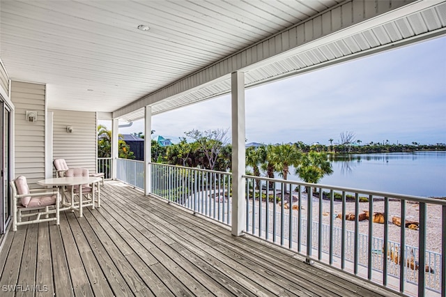 deck featuring a water view