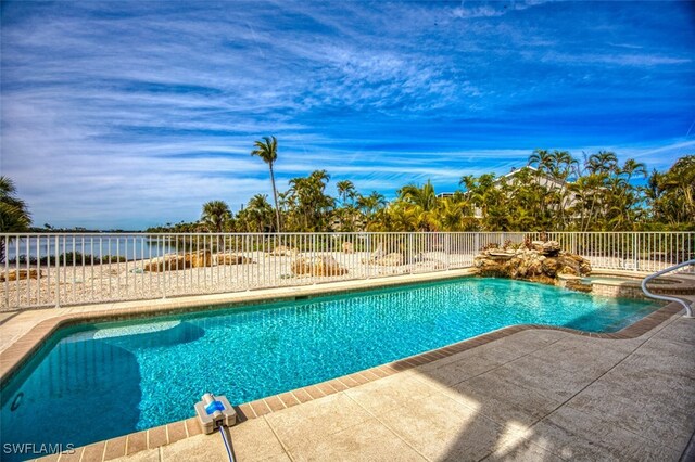 view of swimming pool with a patio