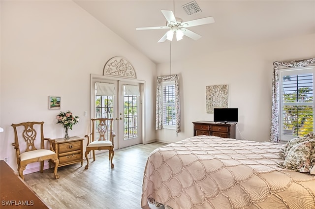 bedroom with french doors, light wood-type flooring, ceiling fan, high vaulted ceiling, and access to outside