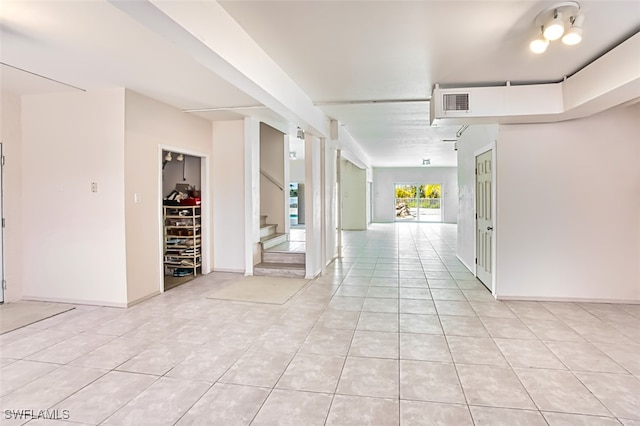 hallway featuring light tile patterned floors