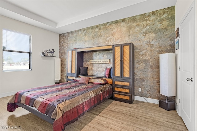 bedroom featuring light hardwood / wood-style floors