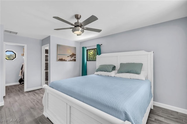 bedroom featuring ceiling fan and wood-type flooring