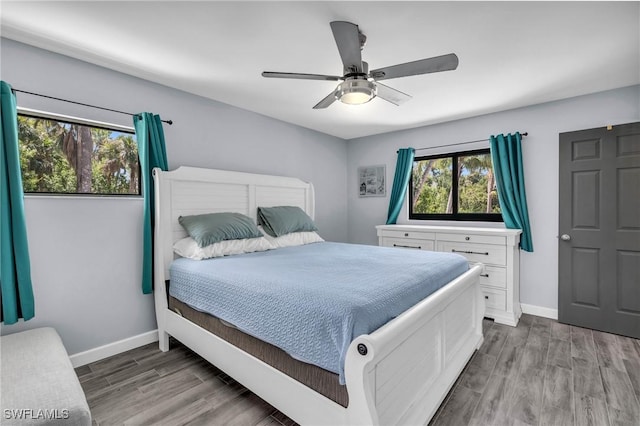 bedroom featuring wood-type flooring and ceiling fan