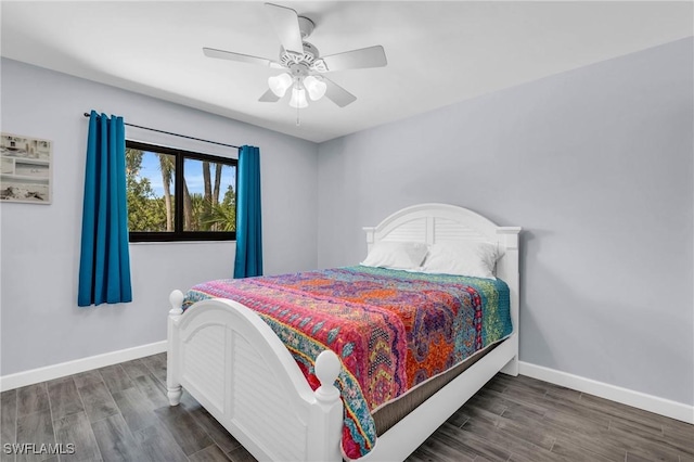 bedroom featuring dark wood-type flooring and ceiling fan