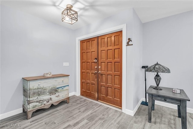 entryway with light hardwood / wood-style flooring