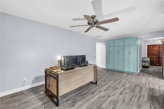 office space with light hardwood / wood-style flooring and ceiling fan