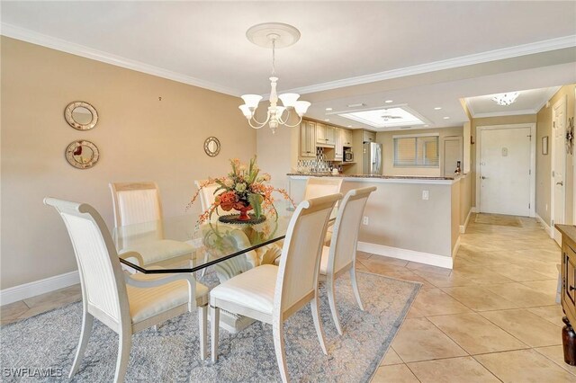 tiled dining space featuring a notable chandelier and crown molding