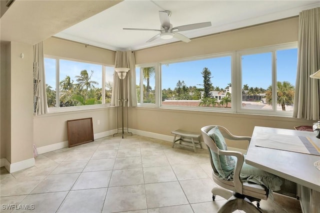 tiled home office featuring ceiling fan