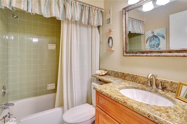 full bathroom featuring vanity, toilet, and shower / tub combo