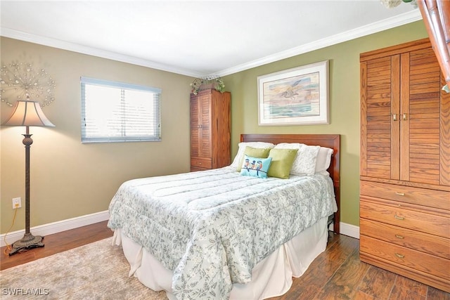 bedroom featuring crown molding and dark hardwood / wood-style flooring