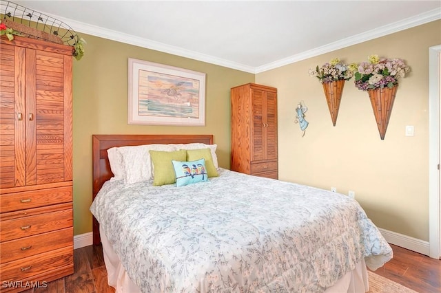 bedroom featuring crown molding and dark wood-type flooring