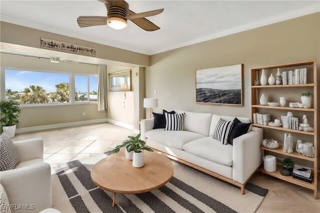 living room featuring crown molding, ceiling fan, and light tile patterned flooring