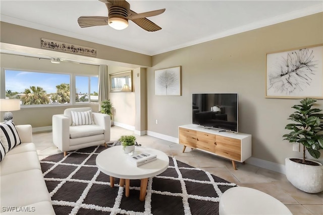 living room featuring crown molding, light tile patterned floors, and ceiling fan