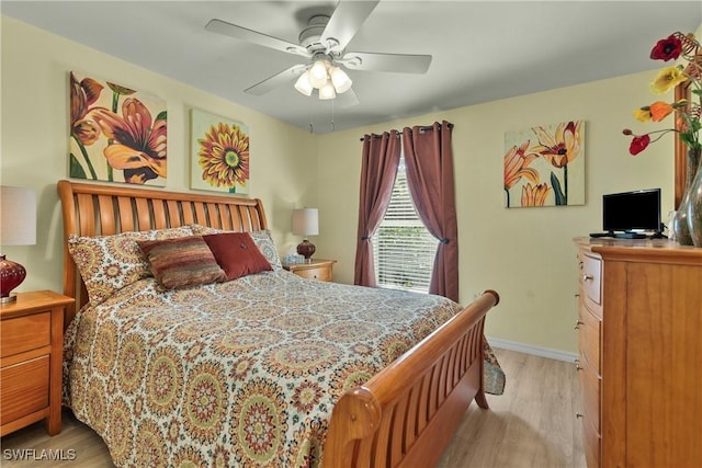 bedroom with ceiling fan and light wood-type flooring