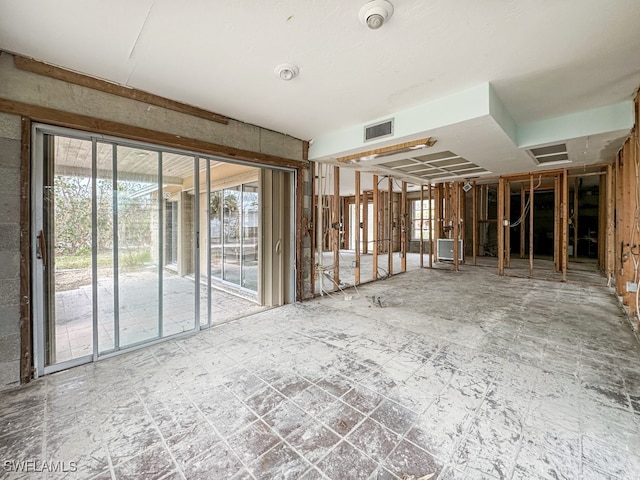 misc room featuring tile patterned floors and a healthy amount of sunlight