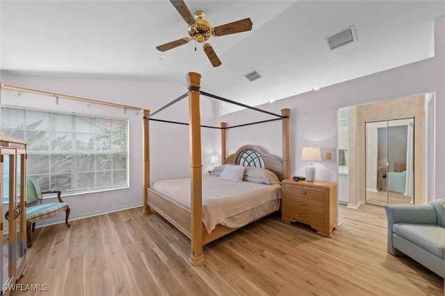 bedroom with baseboards, visible vents, and light wood-style floors