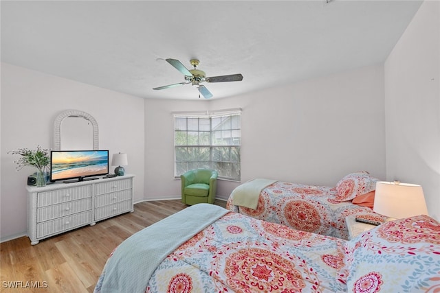 bedroom featuring ceiling fan and light hardwood / wood-style flooring