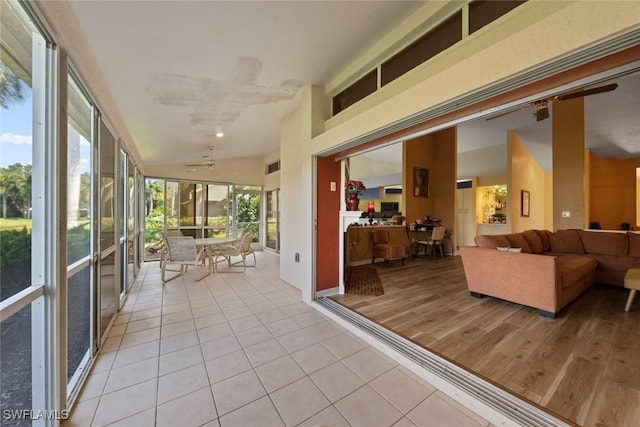 sunroom / solarium featuring vaulted ceiling