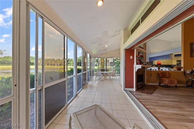 sunroom featuring lofted ceiling