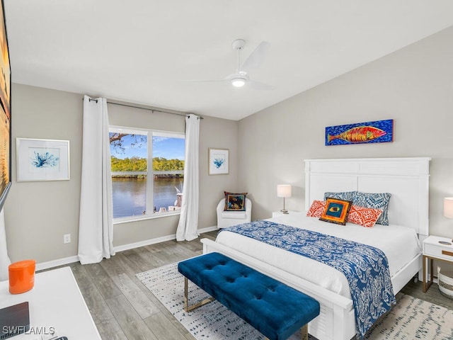 bedroom featuring hardwood / wood-style flooring and ceiling fan