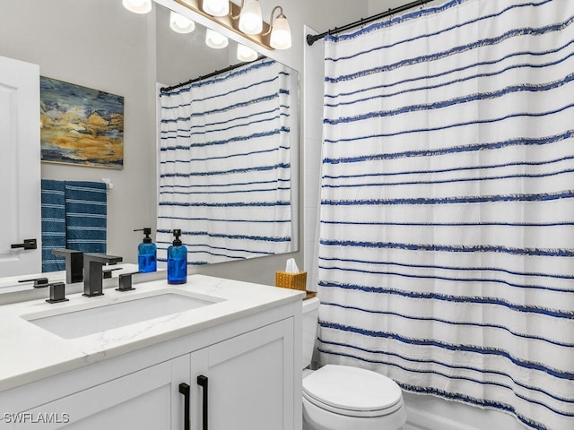 bathroom with vanity and toilet