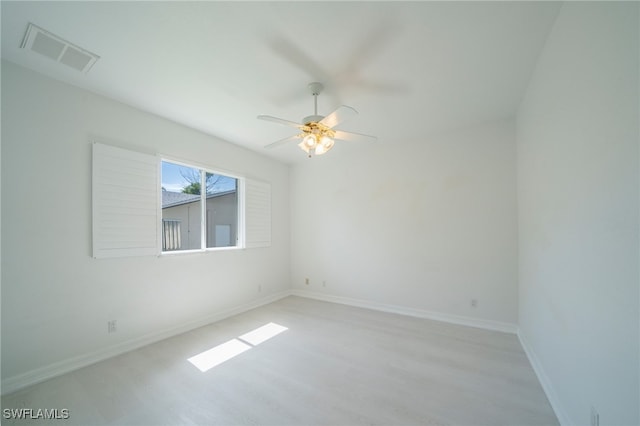 spare room with ceiling fan and light hardwood / wood-style floors