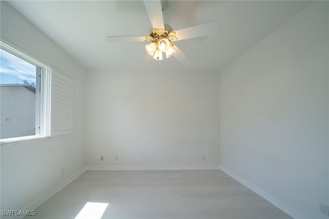 spare room with ceiling fan and light hardwood / wood-style floors