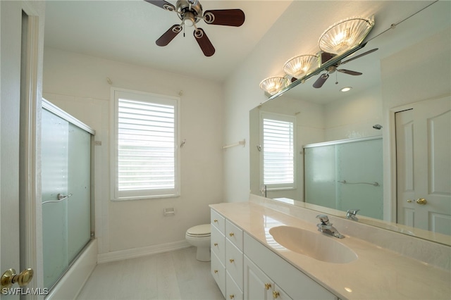 full bathroom featuring ceiling fan, plenty of natural light, and toilet