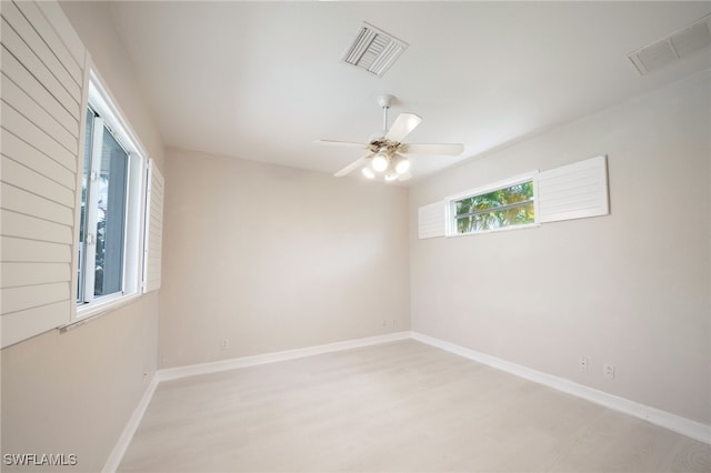 spare room featuring hardwood / wood-style flooring and ceiling fan